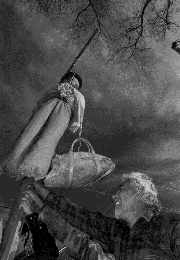 Hispanic activist Ike De Vargas hangs an enviro effigy in
Santa Fe