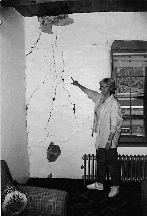 Ann Tatum shows damage caused after subsidence cracked her
house