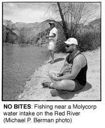 NO BITES: Fishing near a Molycorp water intake on the Red
River