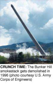 CRUNCH TIME: The Bunker Hill smokestack gets demolished in
1996