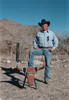 WRANGLING FOR WILDERNESS: Cal Baird and a roping dummy at
his camp on the edge of the South McCulloughs